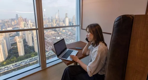 Stunning city-view, quiet-facing coworking desk at Servcorp, One Museum Place, Shanghai, China.